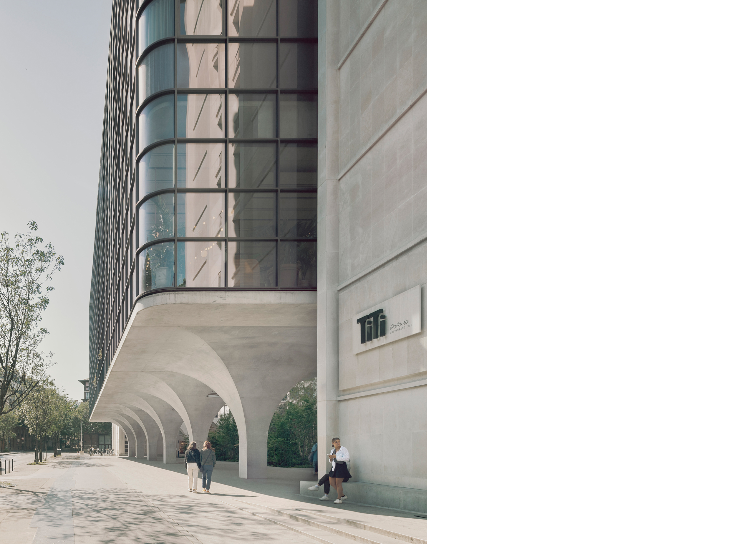 Arcaded pedestrian passage at Morland Mixité Capitale, where a contemporary glazed volume is elevated above sculpted concrete arches, creating a sheltered public route through the site. 