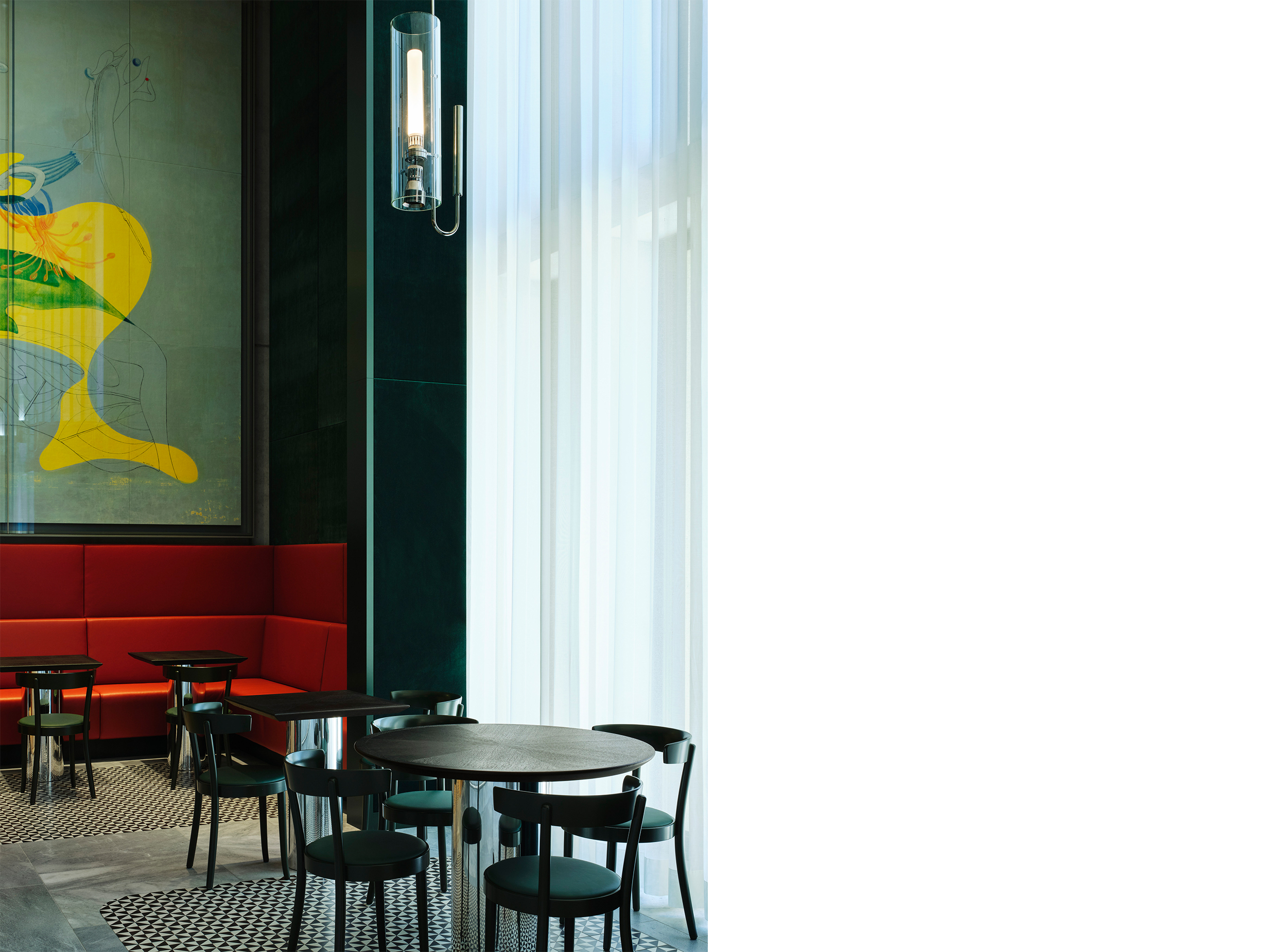 Café interior at the Kunsthaus Zürich Extension with custom seating, contemporary furnishings and artwork by Max Ernst.