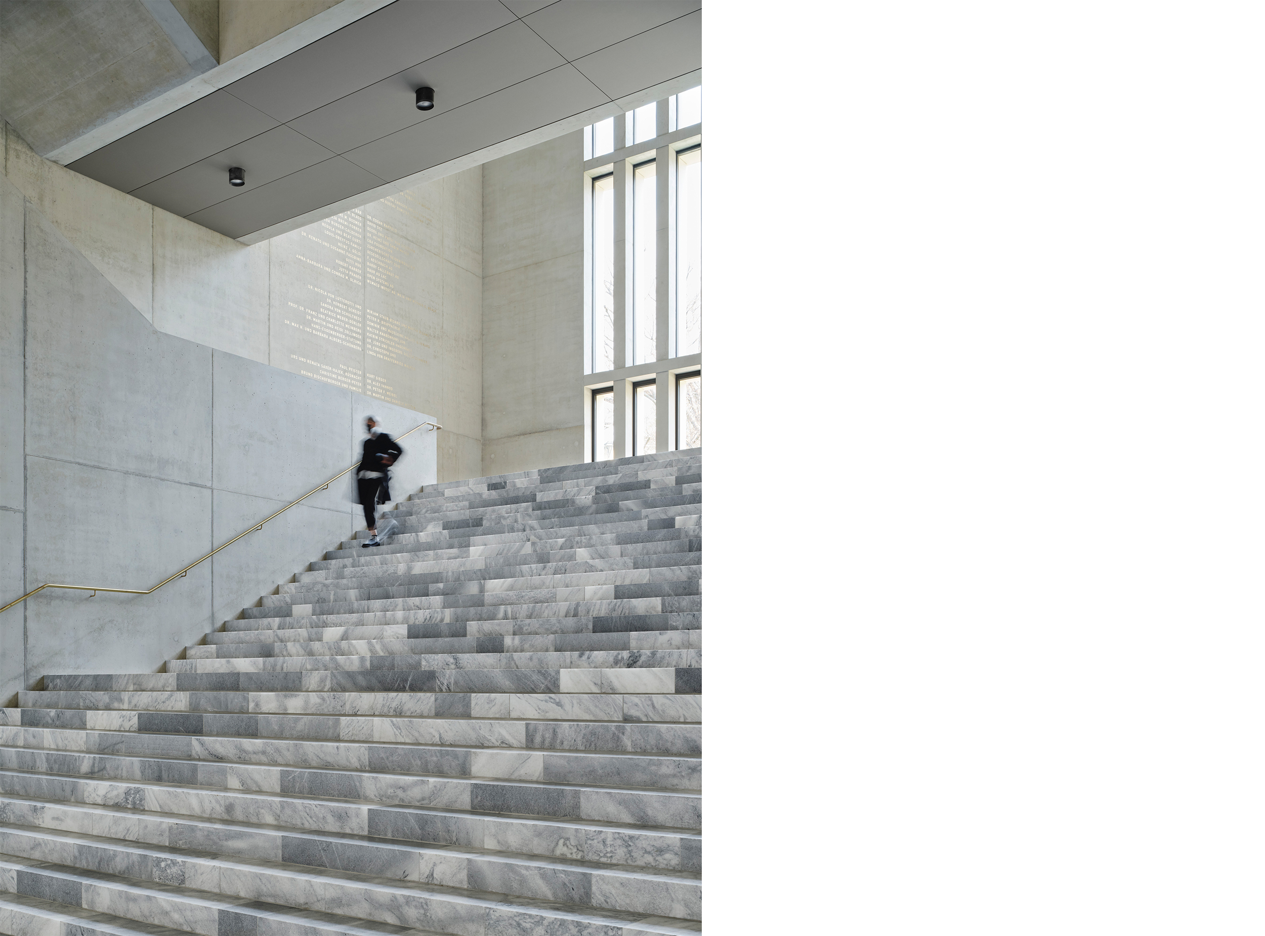 Central marble staircase of the Kunsthaus Zürich Extension, bringing daylight deep into the building and connecting the museum’s public spaces.