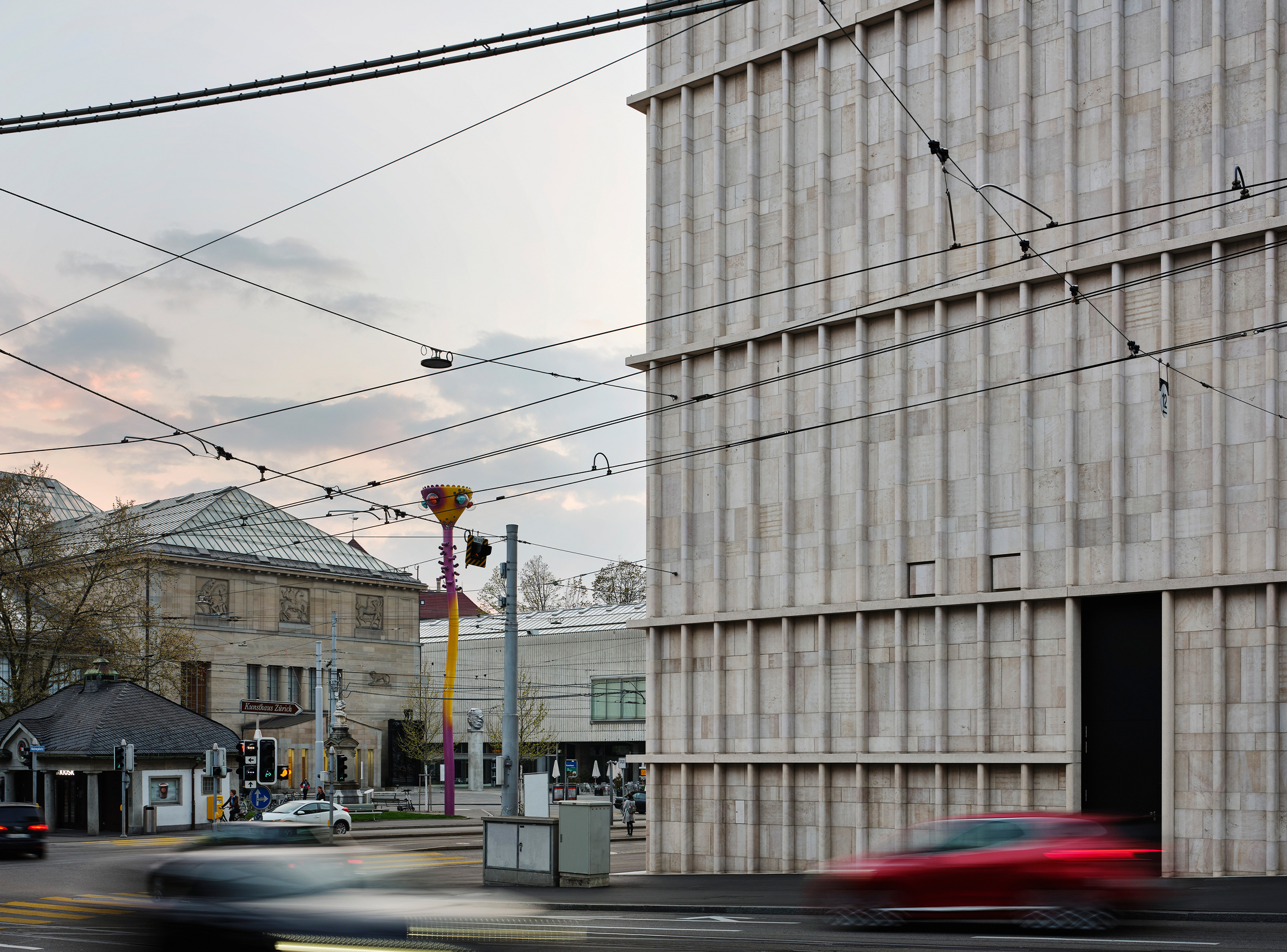 Corner view of the Kunsthaus Zürich Extension, featuring its articulated Jura limestone façade and its relationship to Heimplatz and the surrounding urban context